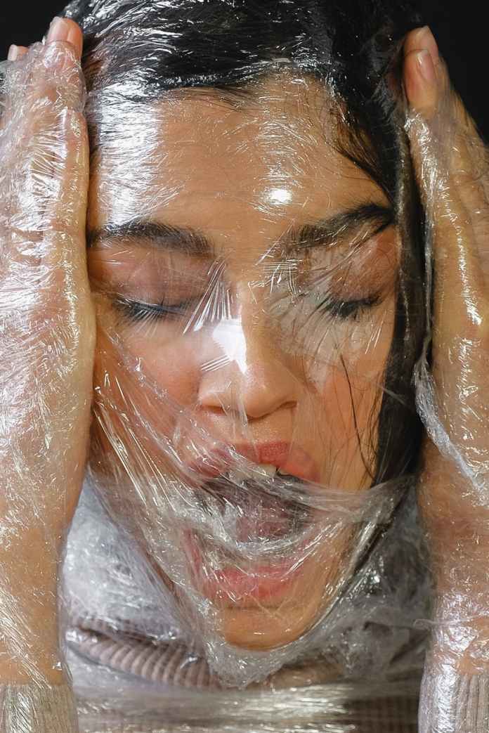 woman wrapped in plastic